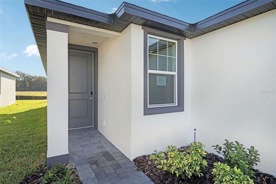 Exterior details and patio area of a home in The Reserve at Hammock Oaks - Classic Series, Lady Lake (Image 3). Exterior details and patio area of a home in The Reserve at Hammock Oaks - Classic Series, Lady Lake (Image 3).