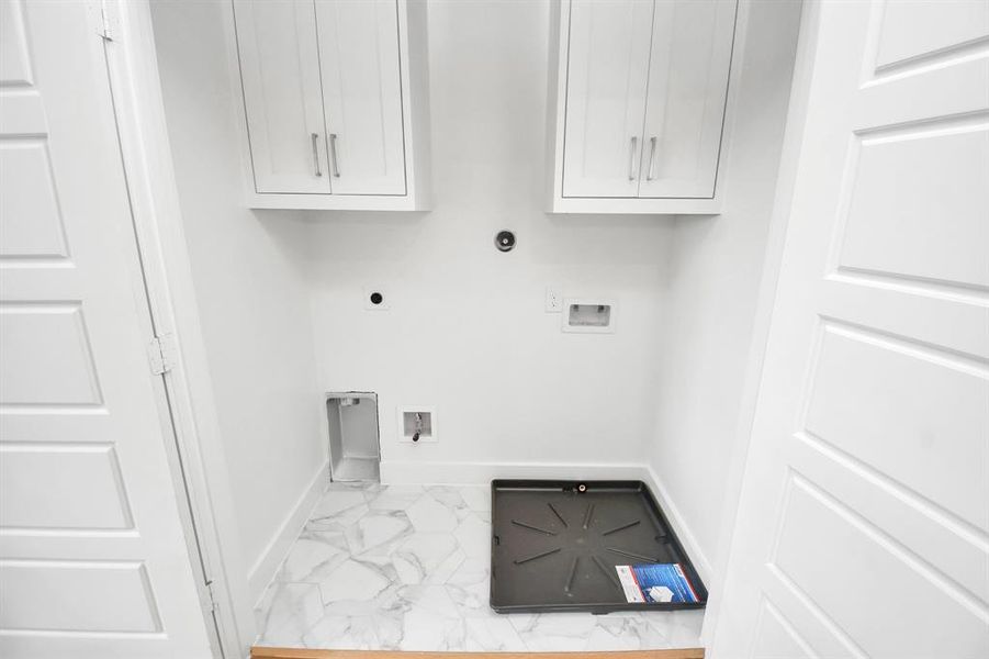 Located upstairs for convenience, the full size utility room offers both gas and electric connections and includes cabinets above for your storage needs!