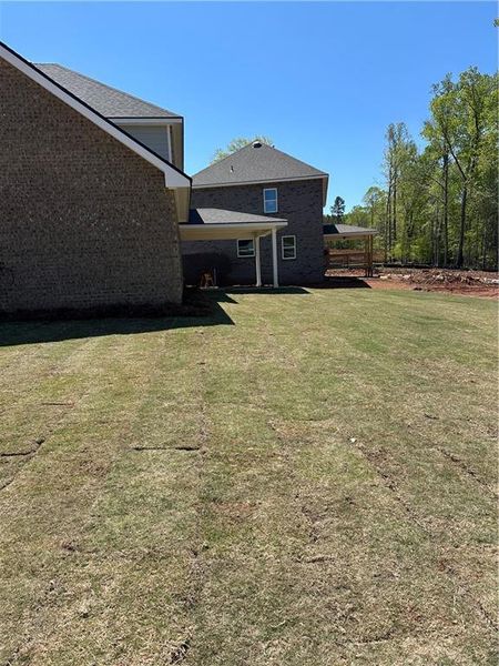 Exterior details and patio area of a home in Mirror Lake at South Harbour, Villa Rica (Image 4).