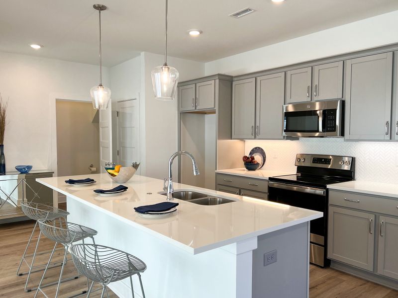 Representative furnished interior of a home built from the Cypress by Perfection Builders in Heritage Commons, Andover (Image 3).