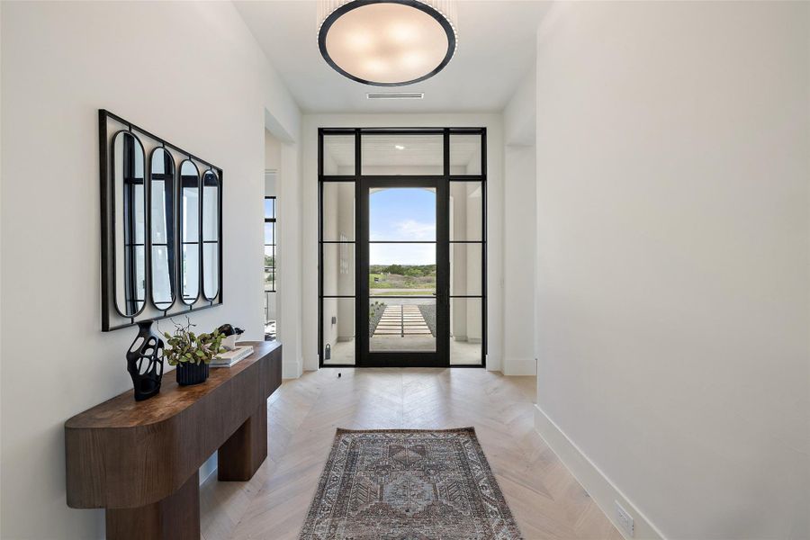 Doorway with visible vents and baseboards Doorway with visible vents and baseboards