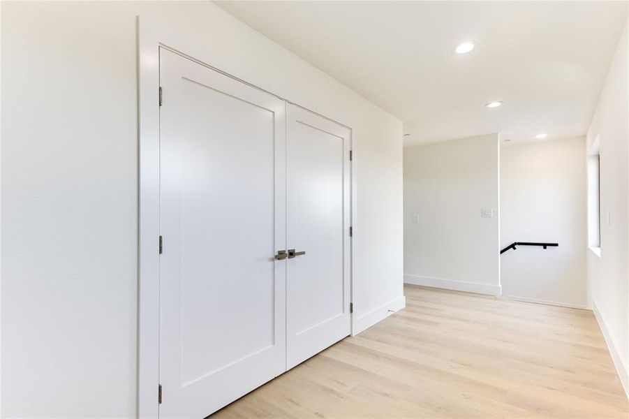 Corridor featuring light hardwood / wood-style flooring