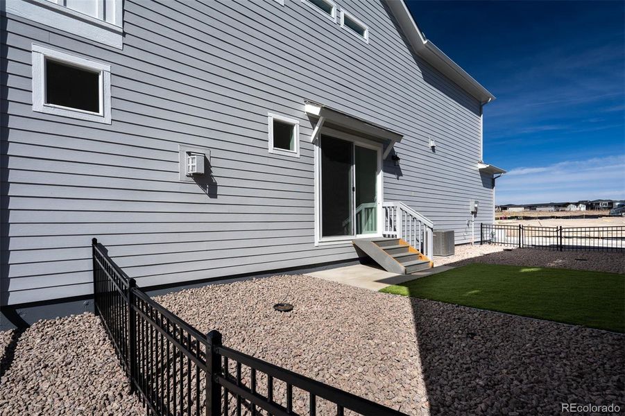 Exterior details and patio area of a home in Revel Crossing at Wolf Ranch – The Ascent Collection, Colorado Springs (Image 22).