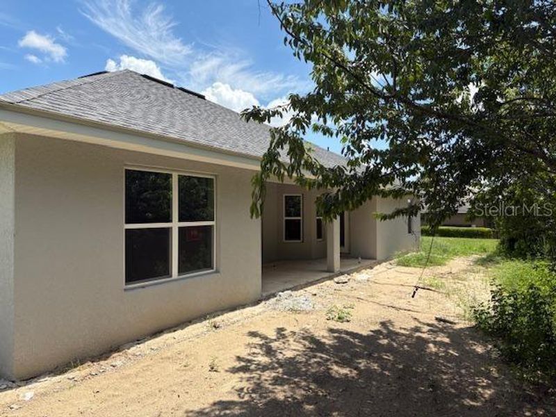 Front exterior of a new home in Juliette Falls, Dunnellon, FL, highlighting curb appeal (Image 10).