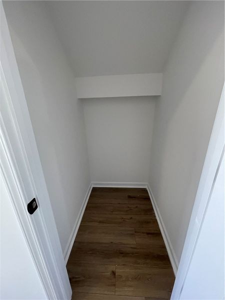This spacious closet offers ample storage with dur