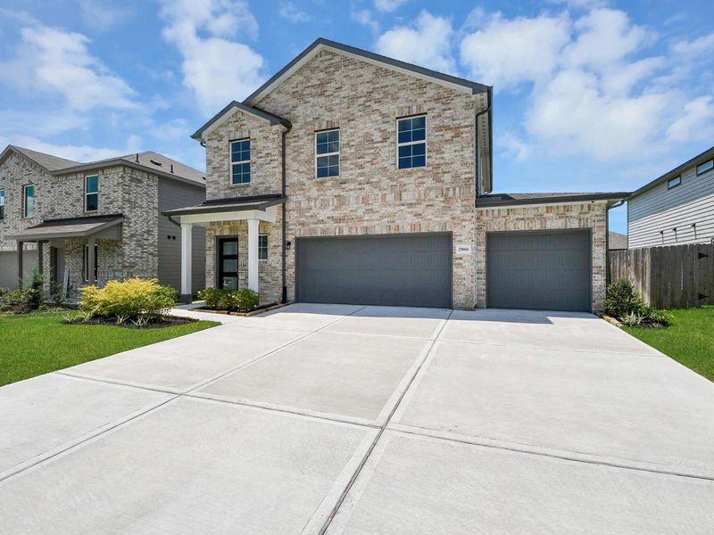 Front exterior of a new home in Hill & Dale Ranch, Splendora, TX, highlighting curb appeal (Image 23).