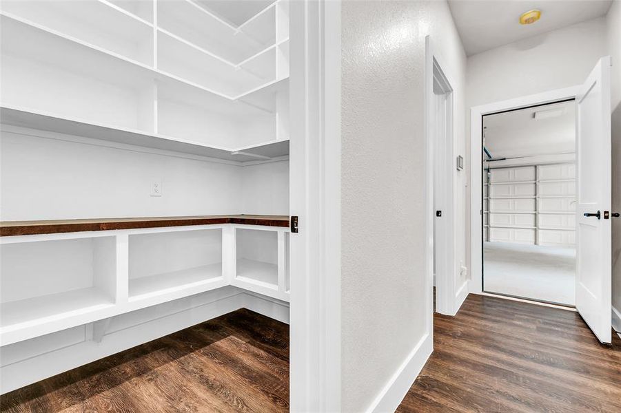 Off kitchen looking towards garage door and half bathroom Off kitchen looking towards garage door and half bathroom