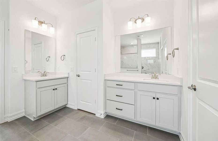 Modern owner's bath with dual vanities and a spacious shower *Real home pictured Modern owner's bath with dual vanities and a spacious shower *Real home pictured