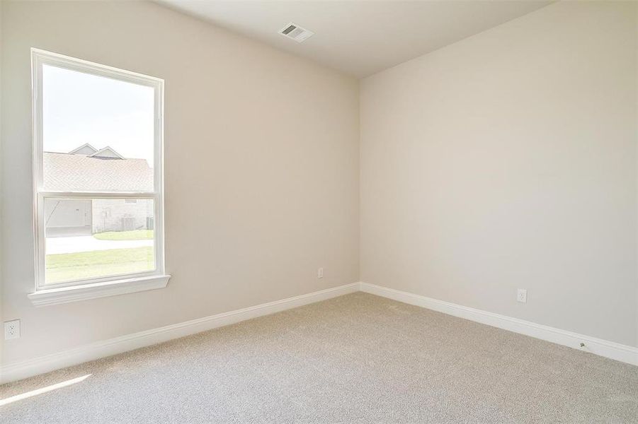 Unfurnished room featuring carpet flooring