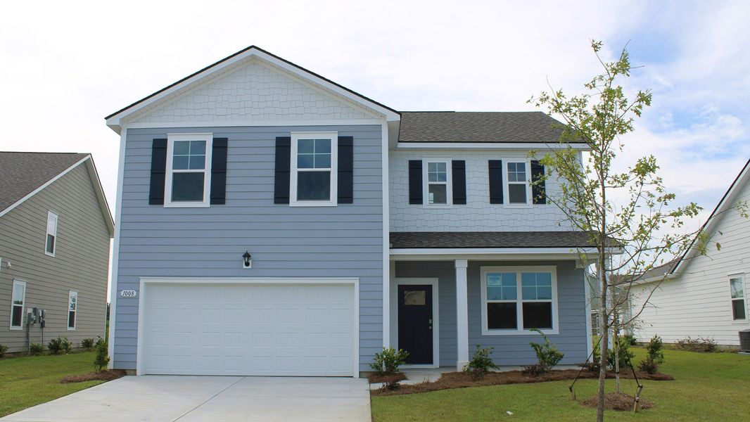 Front exterior of a new home in Kingston Bay, Conway, SC, highlighting curb appeal (Image 1).
