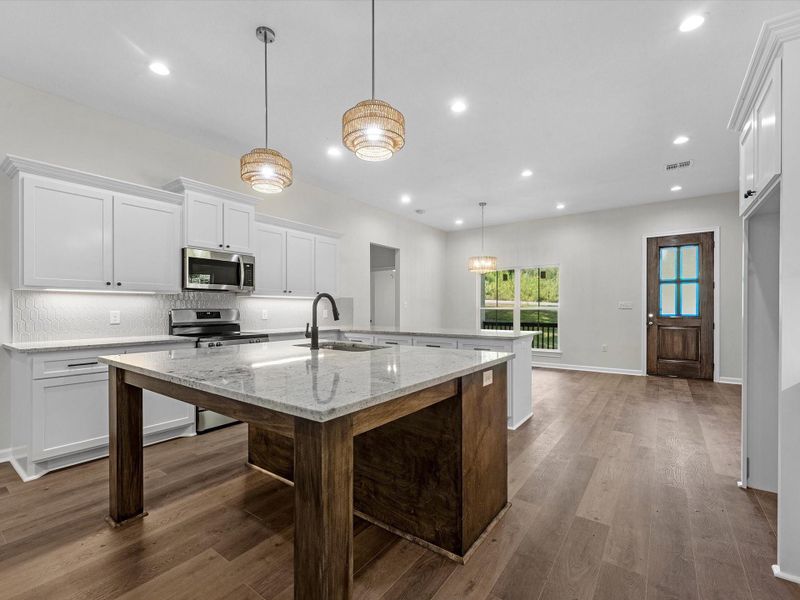 Gorgeous island kitchen and an abundance of counter surface