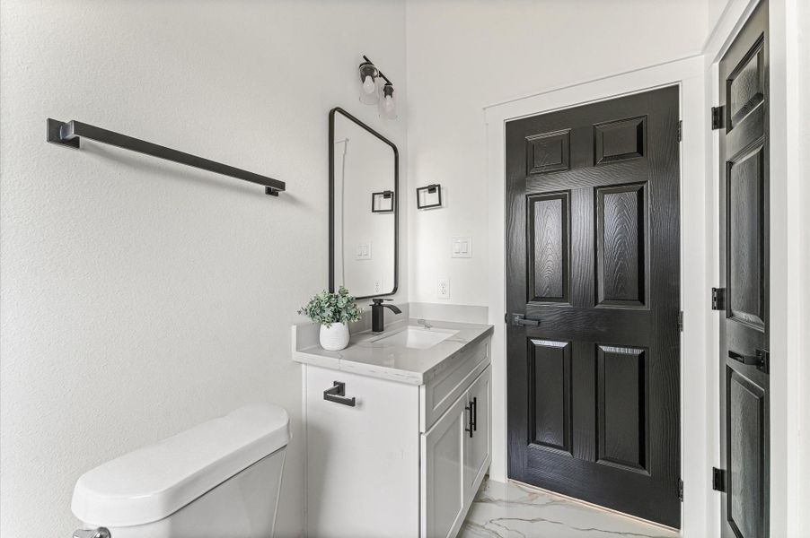 Stylish second bathroom with modern finishes Photos are representative of the same floor plan built by this builder. Finishes will be the same or similar.