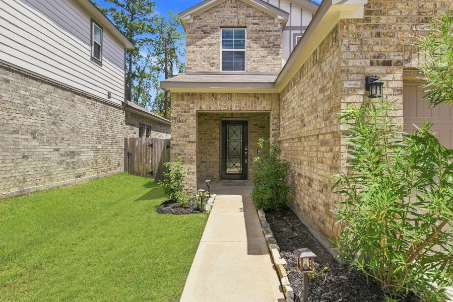 Exterior details and patio area of a home in Lakes at Black Oak, Magnolia (Image 24). Exterior details and patio area of a home in Lakes at Black Oak, Magnolia (Image 24).