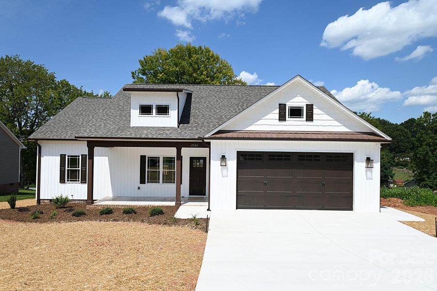 Front exterior of a new home in , Hickory, NC, highlighting curb appeal (Image 28).