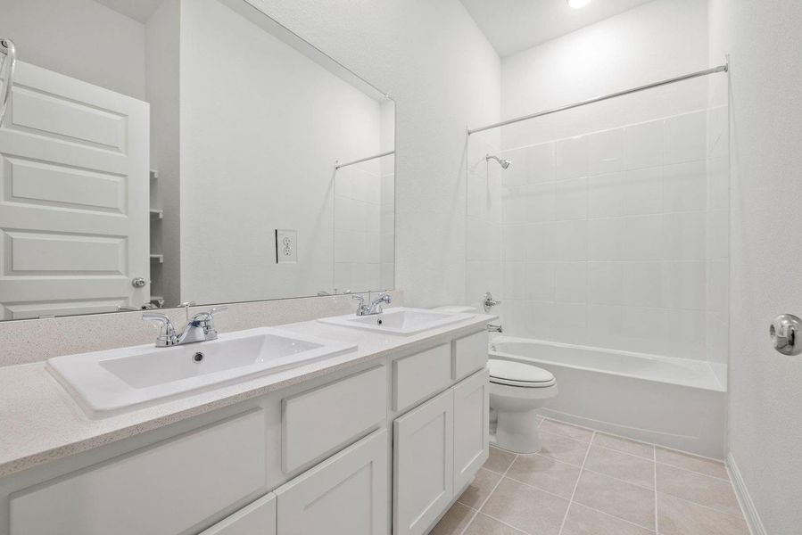 Bathroom in the Quartz home plan by Trophy Signature Homes – REPRESENTATIVE PHOTO Bathroom in the Quartz home plan by Trophy Signature Homes – REPRESENTATIVE PHOTO