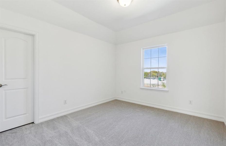 Spacious secondary bedroom with ample closet space *real home pictured