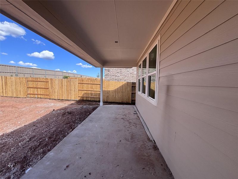 Exterior details and patio area of a home in The Colony 50s, Bastrop (Image 14).
