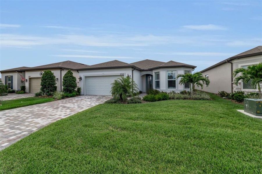 Front exterior of a new home in , Parrish, FL, highlighting curb appeal (Image 25).