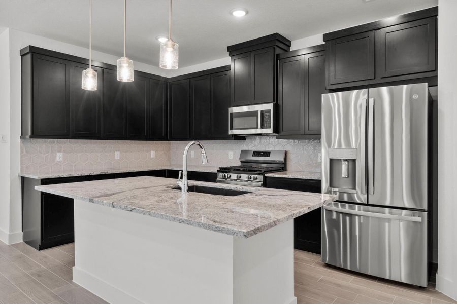 Furnished interior view inside a new home in Meridiana, Iowa Colony (Image 9).