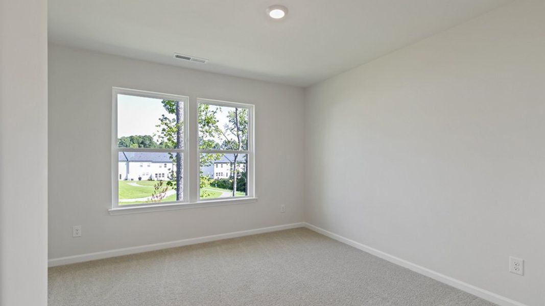 Spacious, unfurnished interior of a new home in Copper Run South, Durham (Image 21).