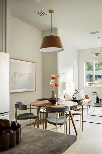 Dining space featuring wood finished floors