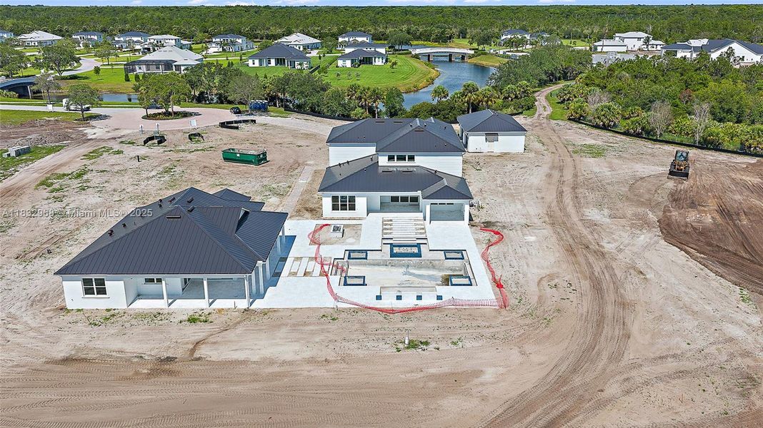 Front exterior of a new home in Bridgewater, Jupiter, FL, highlighting curb appeal (Image 22). Front exterior of a new home in Bridgewater, Jupiter, FL, highlighting curb appeal (Image 22).