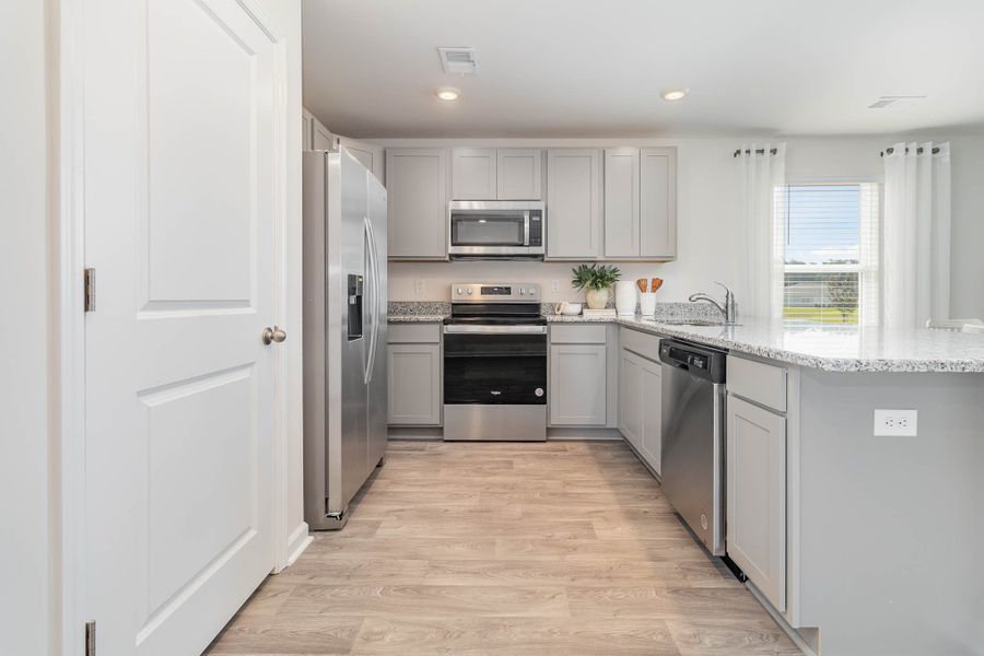 Representative furnished interior of a home built from the HELENA by D.R. Horton in Jordanville Farms, Galivants Ferry (Image 15).