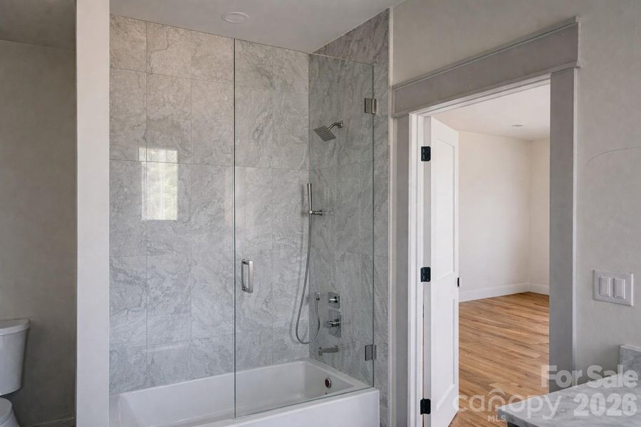 Upstairs features two bedrooms each with an ensuite bath with floor to ceiling tile.