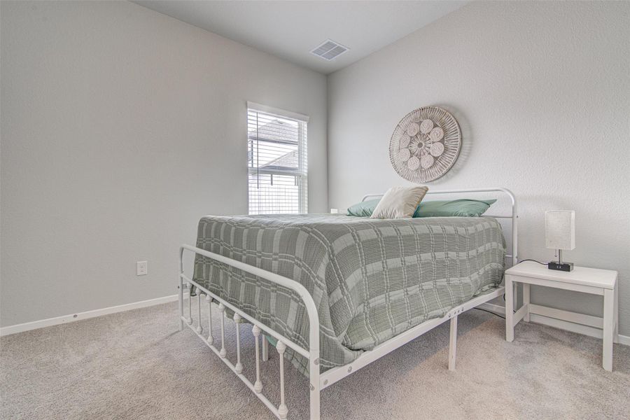 Well-lit and tranquil, this bedroom provides a peaceful retreat with its soft neutral palette. Well-lit and tranquil, this bedroom provides a peaceful retreat with its soft neutral palette.