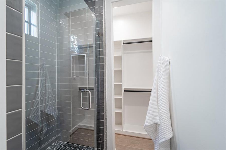 Bathroom with a shower with shower door