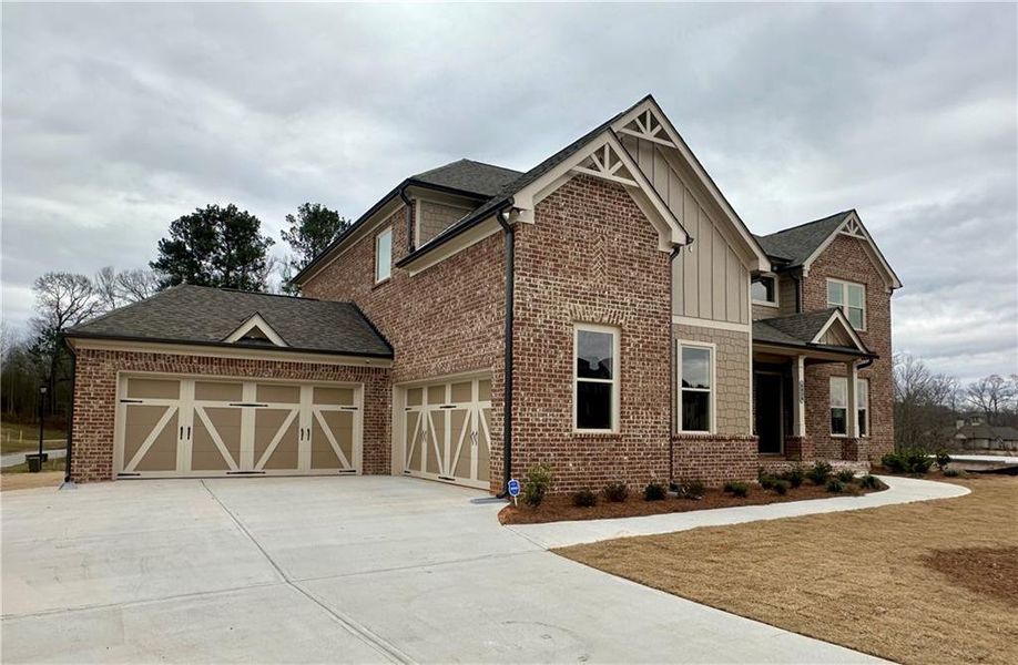 Front exterior of a new home in Sierra Lake, Cumming, GA, highlighting curb appeal (Image 2).