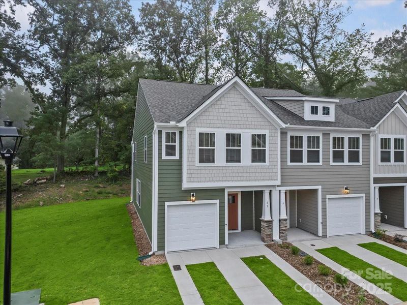 Front exterior of a new home in Clayton Crossing, Arden, NC, highlighting curb appeal (Image 2). Front exterior of a new home in Clayton Crossing, Arden, NC, highlighting curb appeal (Image 2).