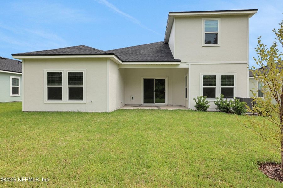Front exterior of a new home in Cordova Palms, St. Augustine, FL, highlighting curb appeal (Image 18).