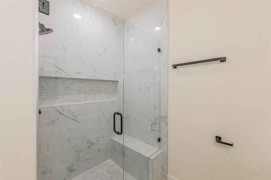 Bathroom with a shower with shower door