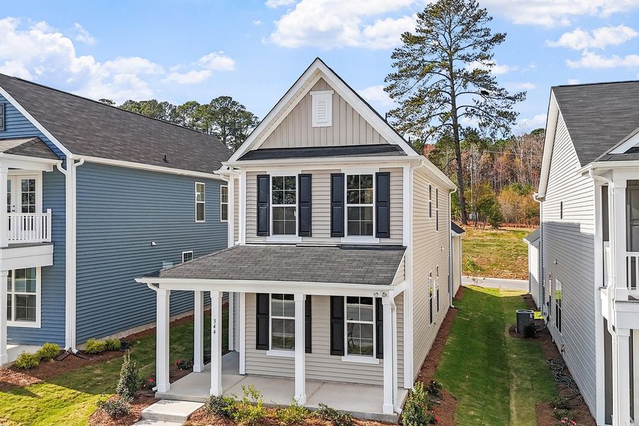 Front exterior of a new home in Renaissance at White Oak, Garner, NC, highlighting curb appeal (Image 15).