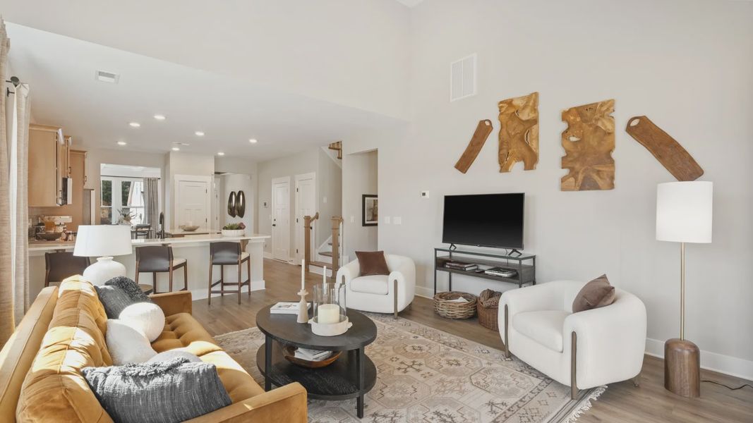 Spacious and stylish family room with two-story ceilings that create a bright and open atmosphere near Downtown Fountain Inn