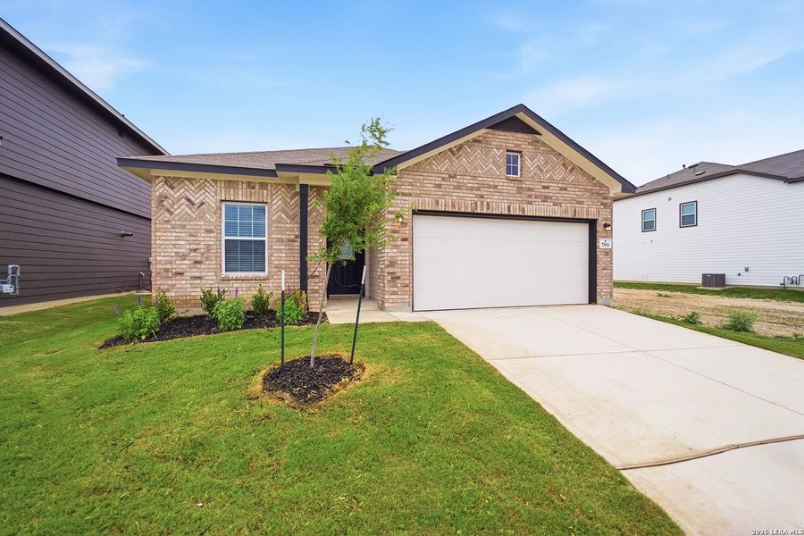Front exterior of a new home in Hennersby Hollow, San Antonio, TX, highlighting curb appeal (Image 1). Front exterior of a new home in Hennersby Hollow, San Antonio, TX, highlighting curb appeal (Image 1).