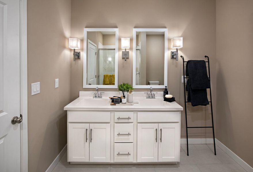 Primary bath with dual white-framed mirrors Primary bath with dual white-framed mirrors