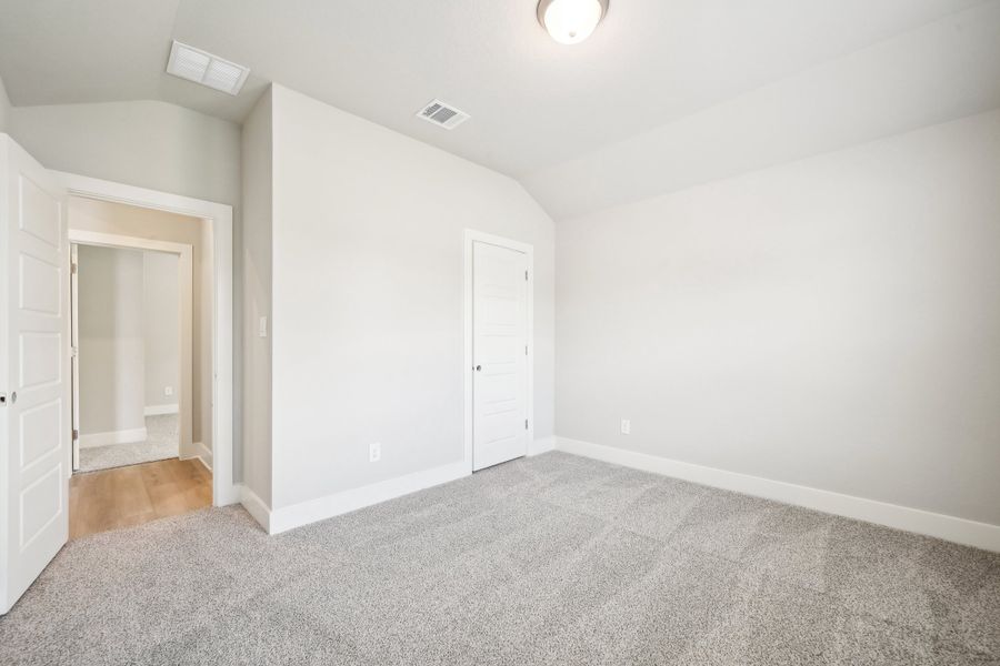 Guest bedroom in the Preston floorplan at a Meritage Homes community.