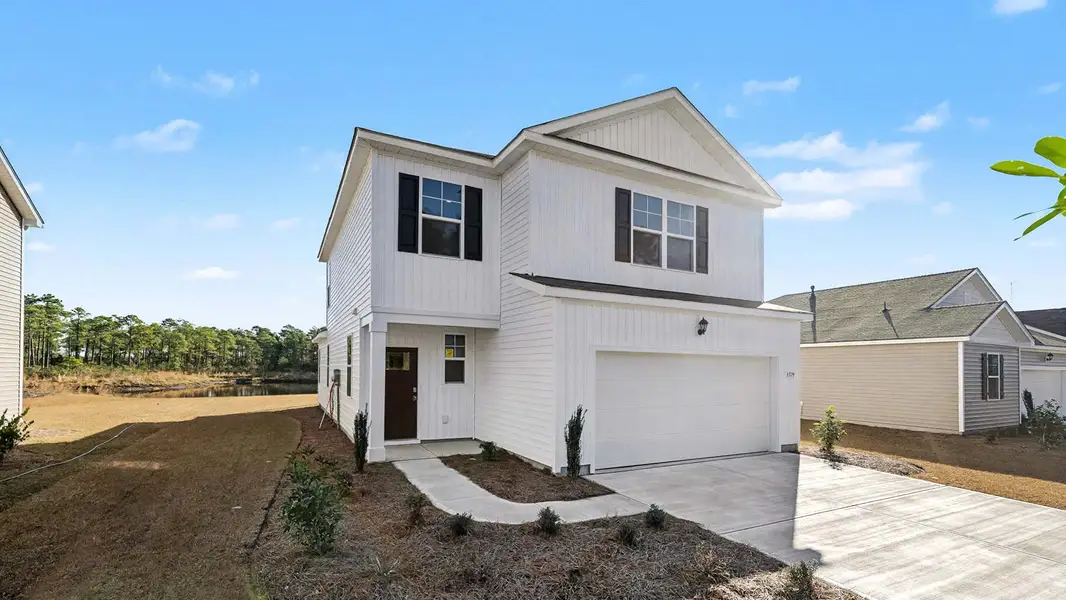 Front exterior of a new home in Ridgefield, Conway, SC, highlighting curb appeal (Image 2).