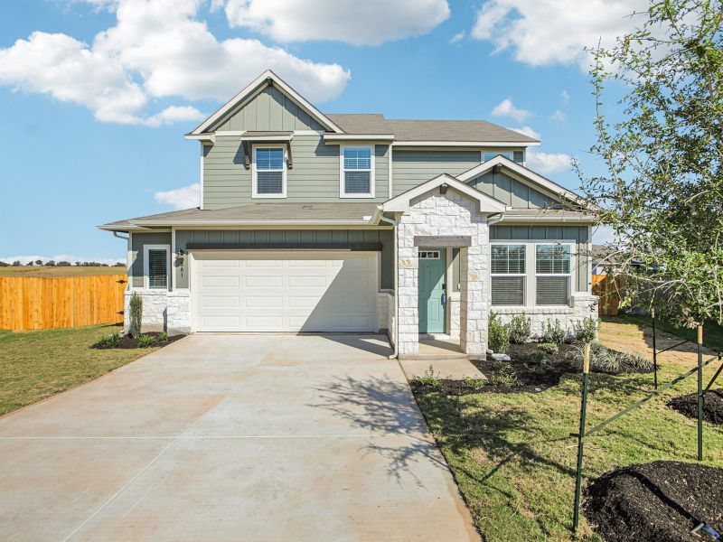 Front exterior of a new home in Waterstone Crossing, Kyle, TX, highlighting curb appeal (Image 1). Front exterior of a new home in Waterstone Crossing, Kyle, TX, highlighting curb appeal (Image 1).