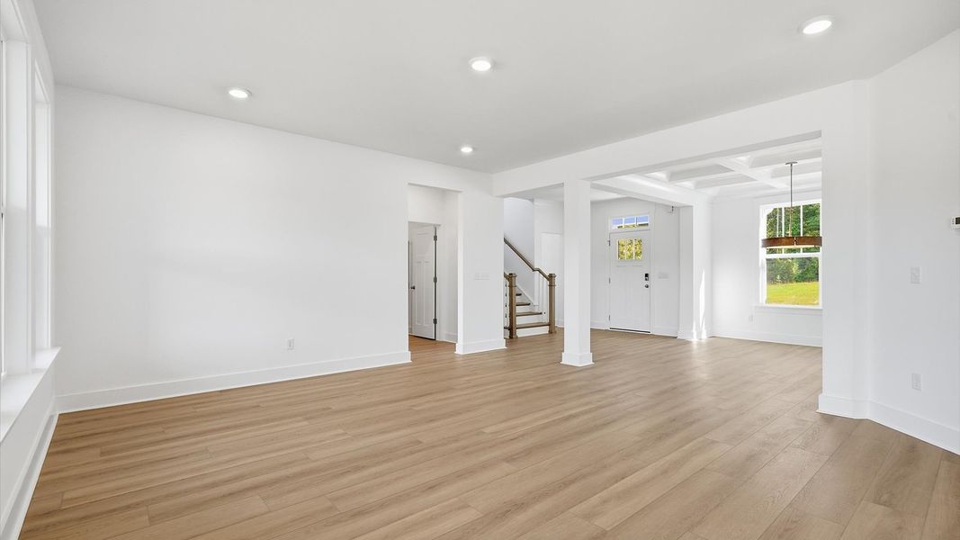 Memorable moments begin in this elegant, open family room with hardwood flooring and refined finishes at Pinebrook