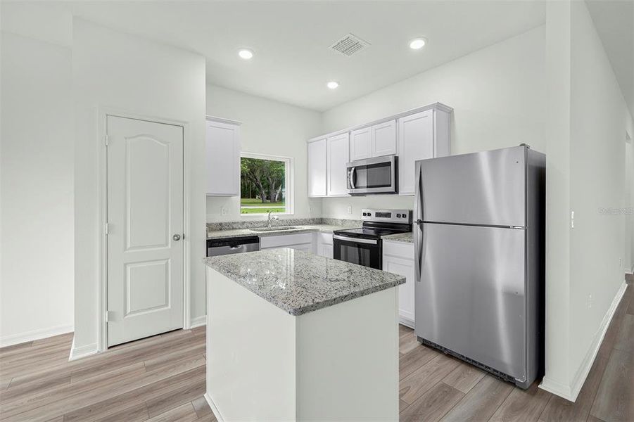 Furnished interior view inside a new home in Tula Parc, Astatula (Image 7).