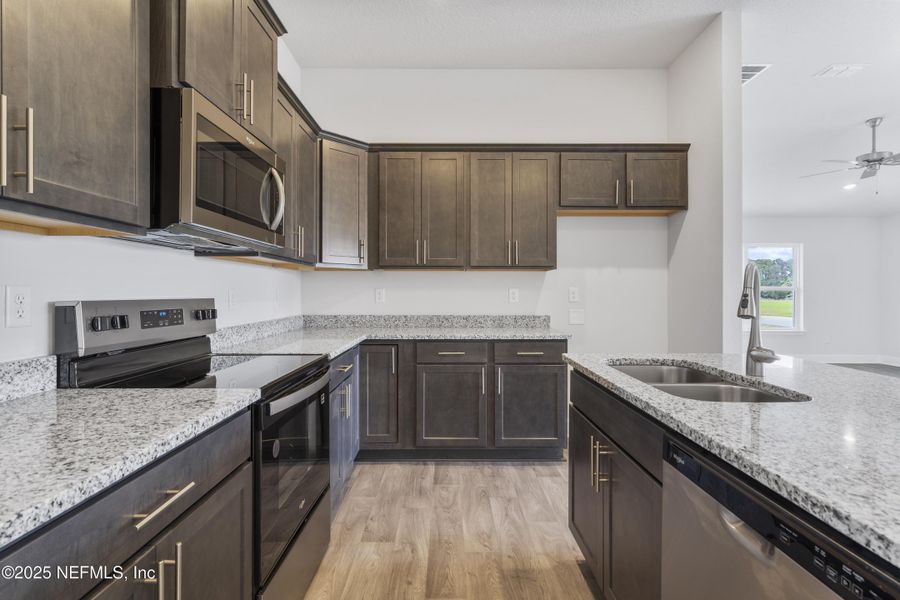 Furnished interior view inside a new home in Shadow Crest at Rolling Hills, Green Cove Springs (Image 4). Furnished interior view inside a new home in Shadow Crest at Rolling Hills, Green Cove Springs (Image 4).