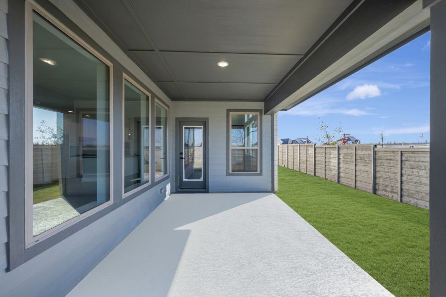 Exterior details and patio area of a home in Treeline, Justin (Image 3).