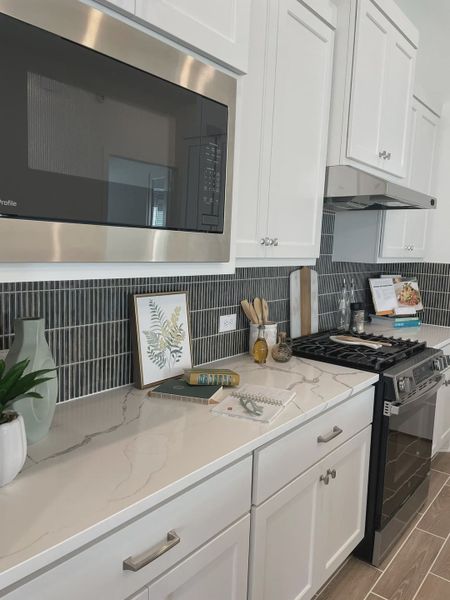 Representative furnished interior of a home built from the Mickelson by Chesmar Homes in Riceland Alley Loads, Mont Belvieu (Image 49).