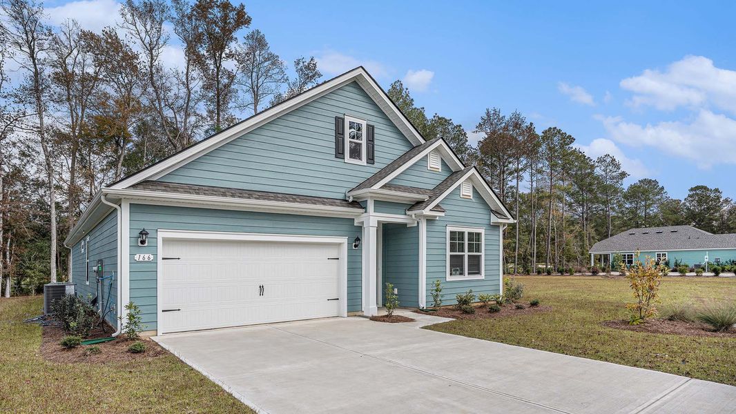Front exterior of a new home in The Bluffs at Mill Creek, Florence, SC, highlighting curb appeal (Image 2). Front exterior of a new home in The Bluffs at Mill Creek, Florence, SC, highlighting curb appeal (Image 2).