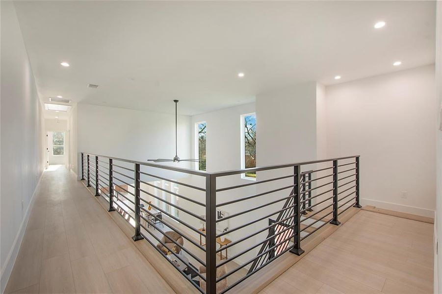 Corridor with light hardwood / wood-style floors