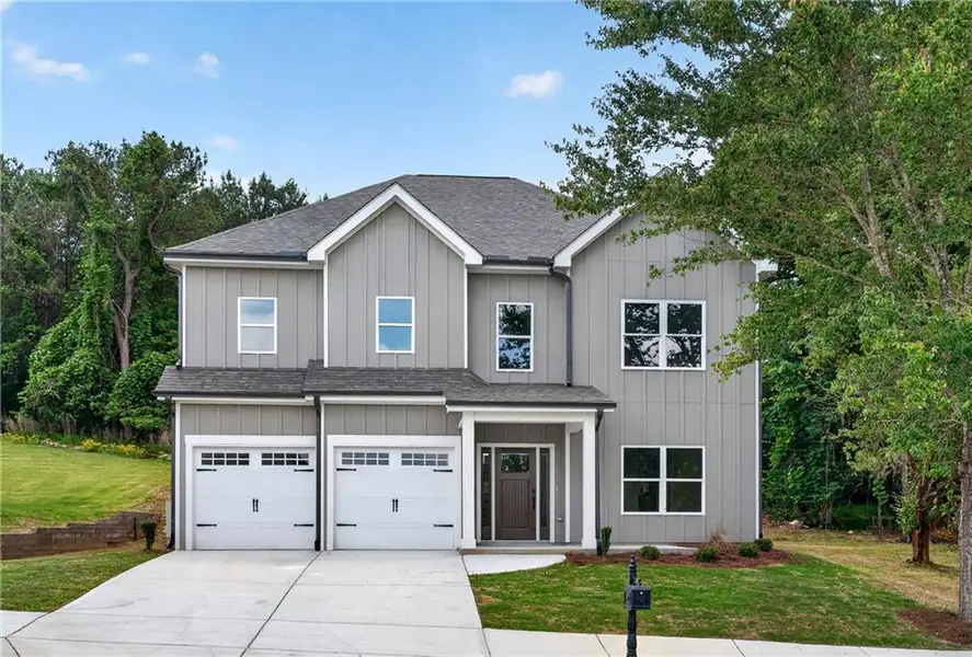 Front exterior of a new home in , Fairburn, GA, highlighting curb appeal (Image 2). Front exterior of a new home in , Fairburn, GA, highlighting curb appeal (Image 2).