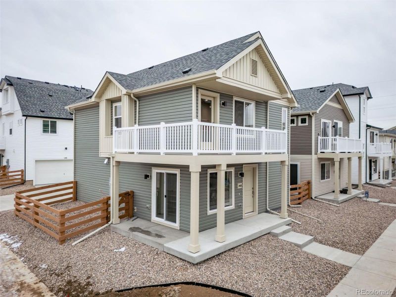 Front exterior of a new home in Muegge Farms, Bennett, CO, highlighting curb appeal (Image 24). Front exterior of a new home in Muegge Farms, Bennett, CO, highlighting curb appeal (Image 24).